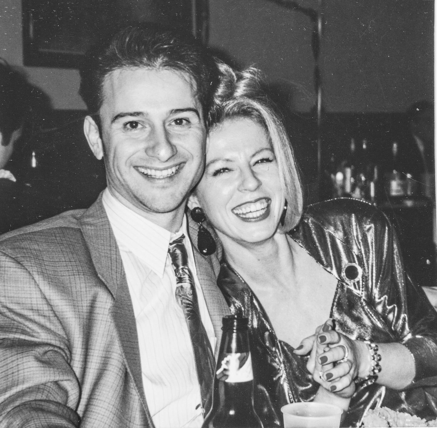black and white photo of Lina and her friend laughing in their twenties