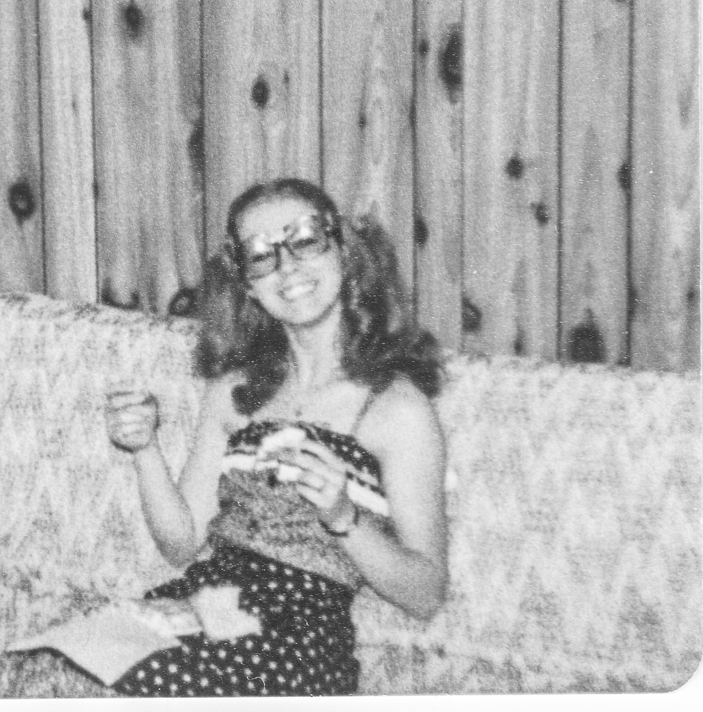 black and white photo of Lina on a couch in the 70s