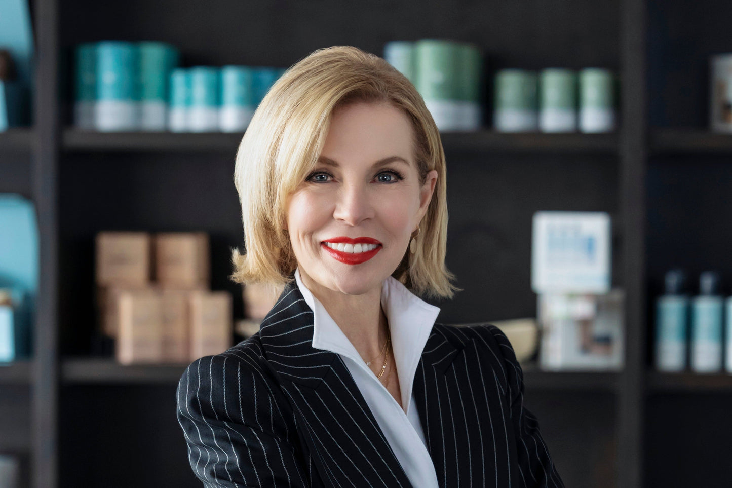Lina posing in front of Alexandria Professional retail products